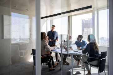 Group of people working in a boardroom