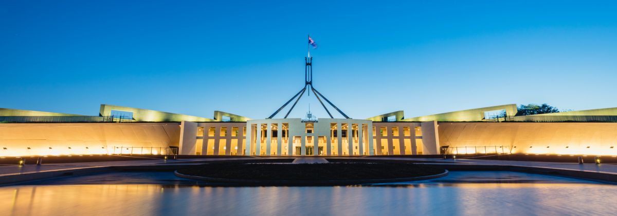 Parliament House Australia with large water feature in front.